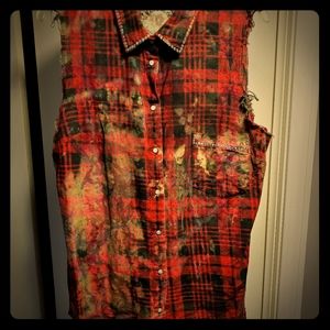 Distressed sleeveless button down